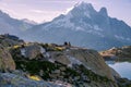 Man Playing Guitar in front of Iconic Mount-Blanc Mountain Range on a Bright Morning