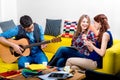 Man playing a guitar with girlfriends Royalty Free Stock Photo