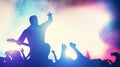 Man playing guitar at the stage, crowd cheering Royalty Free Stock Photo