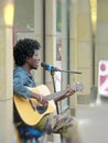 Man playing guitar in the street. Musician on the street.