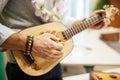 A man playing guitar ukulele in close up view. Royalty Free Stock Photo