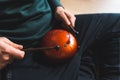 man playing on a happy drum with multi-notes by sticks