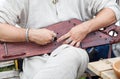 Man is playing the harp. hands closeup