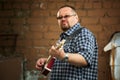 Man playing his cigar box guitar Royalty Free Stock Photo