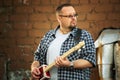 Man playing his cigar box guitar Royalty Free Stock Photo