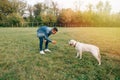 Man playing with his dog labrador Royalty Free Stock Photo
