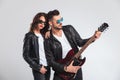 Man playing electric guitar for his woman Royalty Free Stock Photo