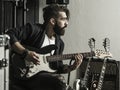 Man playing his electric guitar in a music studio Royalty Free Stock Photo