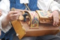 Man playing hurdy gurdy