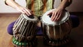 Man playing on Indian tabla drums