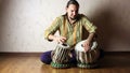 Man playing on Indian tabla drums