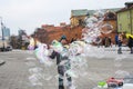 Man playing with making soap ballons in Warsaw city