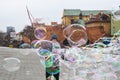 Man playing with making soap ballons in Warsaw city