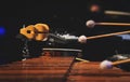 A man playing a marimba on a concert stage