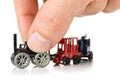 Man playing with metal toy train with locomotive and wagons Royalty Free Stock Photo