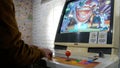 Man playing old game console. Joystick of a vintage arcade videogame - Coin-Op. Close-up of man playing arcade games