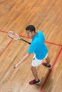 man playing paddle tennis