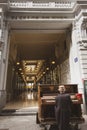 Man playing the piano at the entrance to the Passage du Nord in Brussels, a famous shopping area