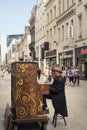 Man playing the piano on Rue Nueve, one of the most popular shopping streets in Brussels