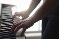 Man playing piano standing in home studio. Royalty Free Stock Photo