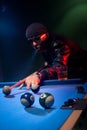 Man playing pool lining up on the cue ball Royalty Free Stock Photo