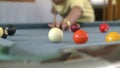 Man playing pool three shots