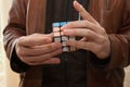 A man playing with a Rubix cube