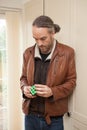 A man playing with a Rubix cube Royalty Free Stock Photo