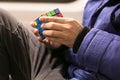 Man playing the Rubix cube Royalty Free Stock Photo