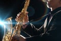 Man Playing Saxophone against black background Royalty Free Stock Photo