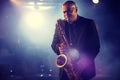 Man Playing Saxophone on Stage Royalty Free Stock Photo
