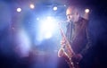 Man Playing Saxophone on Stage Royalty Free Stock Photo