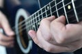 Man playing on semi-acoustic guitar Royalty Free Stock Photo