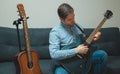 Man playing semi-acoustic guitar