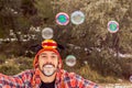 Man playing with soap bubbles