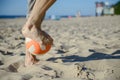 man playing soccer on beach Royalty Free Stock Photo