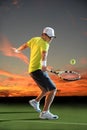 Man Playing Tennis at Sunset Royalty Free Stock Photo