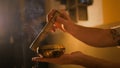 Man playing on tibetian singing bowl Royalty Free Stock Photo