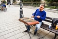 Man playing traditional hammered dulcimer with mallets. Street artist plays songs on the Bucharest`s streets in downtown. Royalty Free Stock Photo