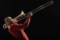 Portrait of Man Playing Trombone side view Royalty Free Stock Photo