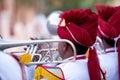 Man Playing trumpet In Indian Wedding Wearing Colorful Dress