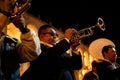 A man playing a trumpet during yearly anniversary celebration