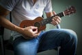 Man playing ukulele