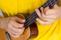 Man playing ukulele