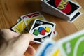 A man playing UNO card game. Royalty Free Stock Photo