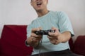 Man playing video game with gamepad front view Royalty Free Stock Photo