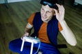 Man Playing Video Games Virtual Reality Glasses In His Apartment. Royalty Free Stock Photo