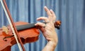 Man playing the violin. hands closeup