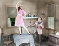 Man playing violin for woman dancing on table Royalty Free Stock Photo