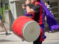 Man playing a wadaiko percussion drum as part of a Japanese para